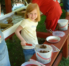 A child panning for gems